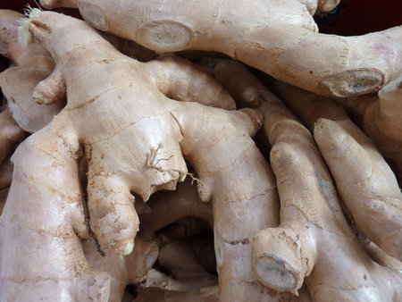 fresh ginger in a box at the greengrocer on the market place