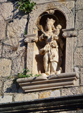 The virgin with the child of the Venetian palace of Zantova in Komiza on the island Vis in Croatiaの写真素材