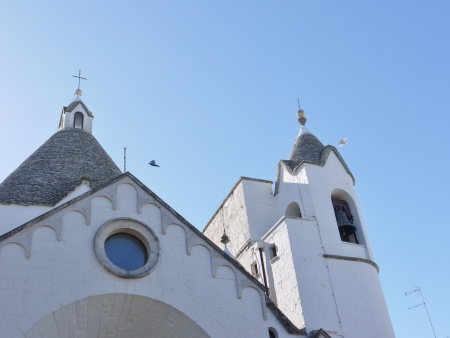 The Trullo Saint Antonio church in Alberobello in Apulia in Italyの写真素材