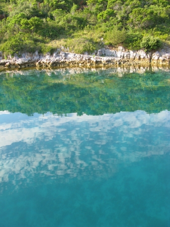 The colors of a rocky coast in a bay in the Adriatic sea of Croatiaの写真素材