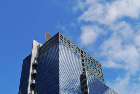 Modern architecture in the commercial district with the reflection of clouds in the glass in...