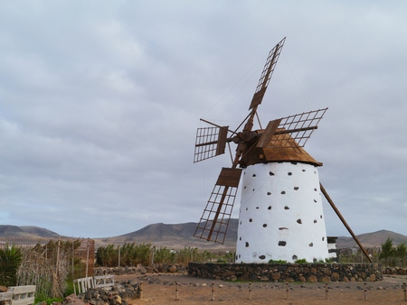Historic wind mill in the surroundings of El Cotillo on the Spanish island Fuerteventura one of the Canary islands in the Atlantic Oceanの写真素材