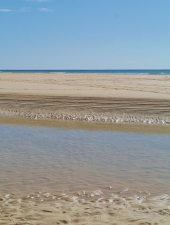 Patterns at low water in the sand of the beach near Costa Calma on Fuerteventura. This island in the...