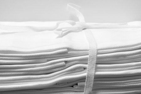 pleated white damast table napkin