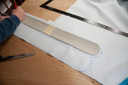 student drawing around a stencil