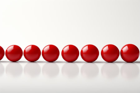 3D rendering of red balls in a row on a white backgroundの素材