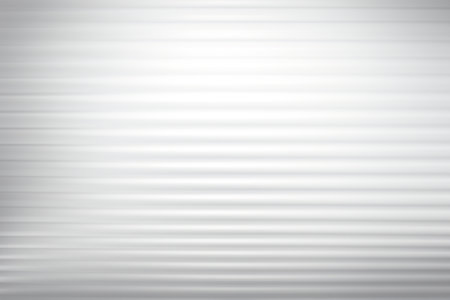 Background with a blurred, abstract pattern in gray and white tones.の素材