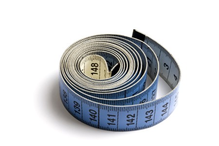 Blue tape measure  rolled on white background の写真素材