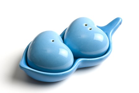 Lovely shaker set of salt and pepper isolated on whiteの写真素材