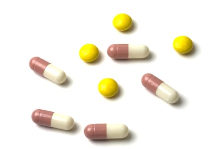 Colourful pills isolated on white backgroundの写真素材