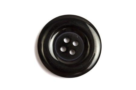  Black clothing button isolated on white background の写真素材