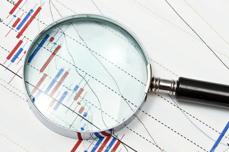Background of business graph and a magnifierの写真素材