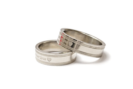 Wedding rings of Forever Love isolated on white background 