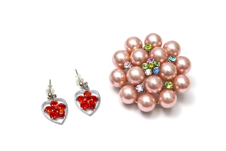 Beautiful pink brooch isolated on white background の写真素材