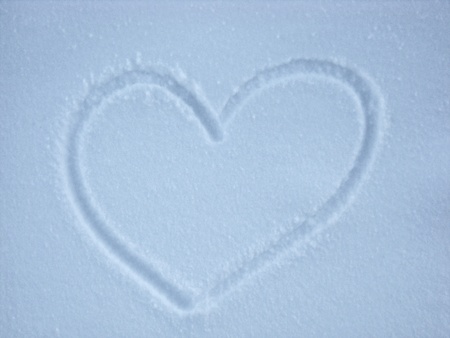 Snow background with heart shapeの写真素材