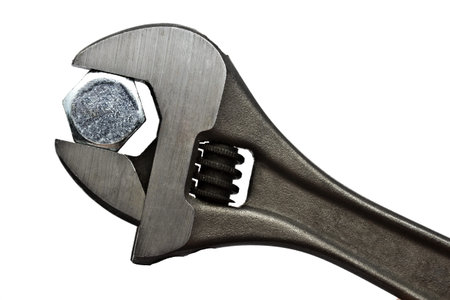 Adjustable wrench and bolt isolated on white background 