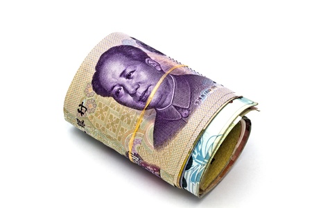 Roll of chinese money closeup on white background の写真素材