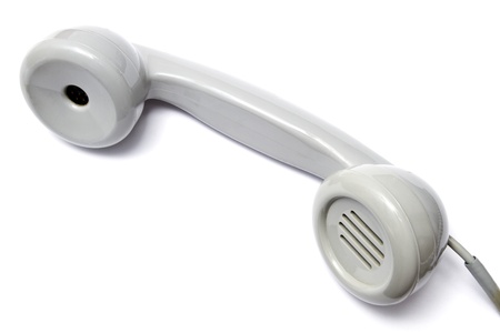 Old gray telephone receiver isolated on white background 
の写真素材