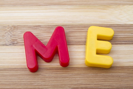 Letters magnets " ME"  closeup on wood background の写真素材