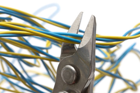 Pliers and wires closeup on white background