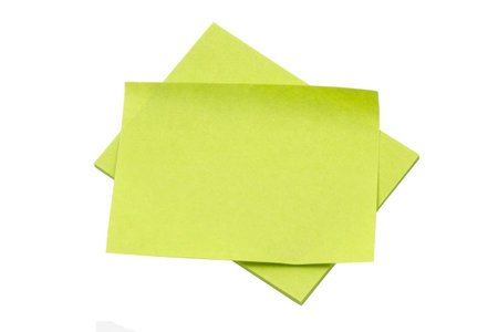 Green memo paper isolated on white background 