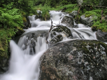 Flowing water of mountain streamの写真素材