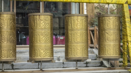Tibetan prayer wheels  in Langmusi, Sichuan, Chinaの写真素材