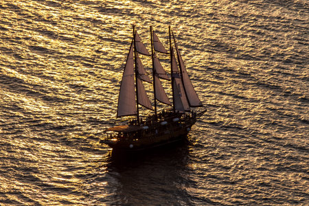 Sailing boat and sunset in Santorini, Creece