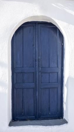 Blue door and white house in Santorini, Greeceの写真素材