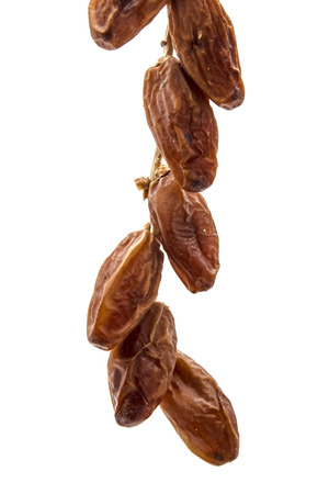 Dry dates isolated on whiteの写真素材