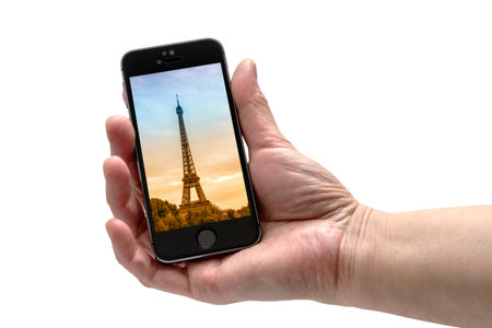 Iphone 5s in a hand isolated on white background