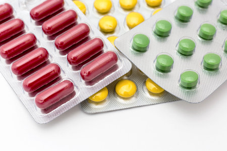Colorful pills closeup on white background
