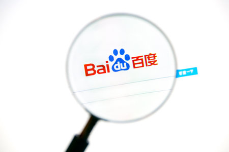 Baidu webpage under a magnifying glass. Baidu, Inc  is a Chinese web services company headquartered at the Baidu Campus in Beijing.のeditorial素材