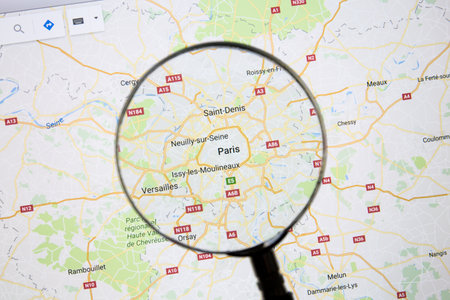 Paris on Google Maps under a magnifying glass.のeditorial素材