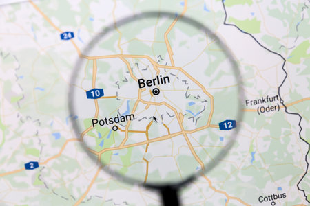 Berlin on Google Maps under a magnifying glass. Berlin is the capital city of Germanyのeditorial素材