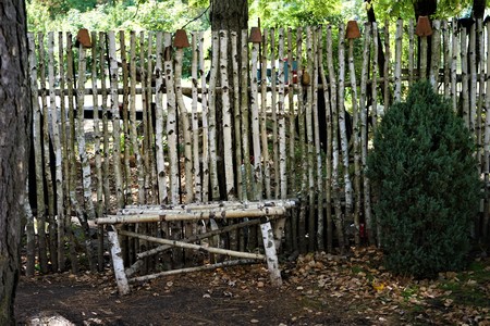 fence and bench made of birch trunksの写真素材