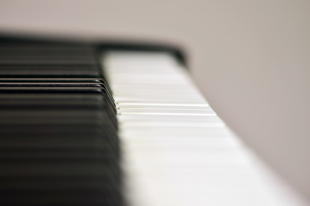 Keys of a digital piano, soft focusing, creative mood. Midi piano keyboard for playing digital music and making remixes.の写真素材