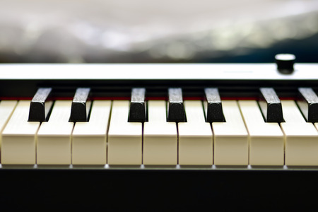 Keys of a digital piano, soft focusing, creative mood. Midi piano keyboard for playing digital music and making remixes.の写真素材