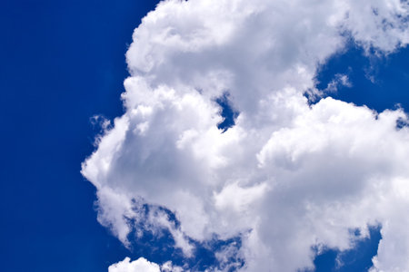 Soaring clouds in the bright blue sky