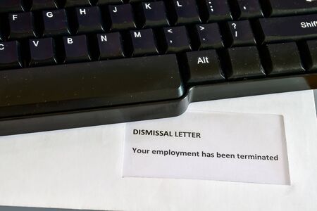 Receiving a Dismissal Letter on the desktopの写真素材