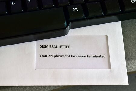 Receiving a Dismissal Letter on the desktopの写真素材