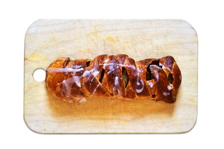 Homemade apple pie on a cutting wooden board isolated on white background. Homemade baking.の写真素材