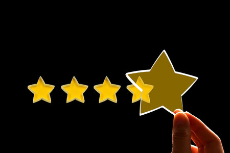 A woman gives a fifth star rating, the concept of a positive rating, reviews and feedback on black...