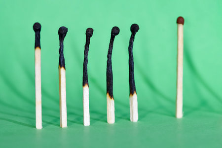 Selective focus. Ð¡losely located matchsticks burnt, when safe distancing between matchsticks...