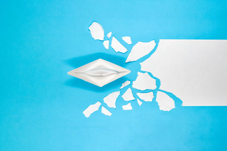 The paper ship as a symbol of business (people), overcomes on its way the problems (ice jams), such...