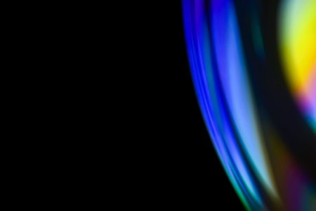 Closeup soap bubble like reflection from lens on dark background. Abstract multicolor psychedelic...