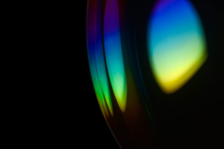 Closeup soap bubble like reflection from lens on dark background. Abstract multicolor psychedelic...