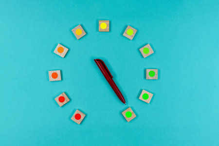Wooden cubes in a circle scale with a measuring arrow, showing changes from red to green level on...