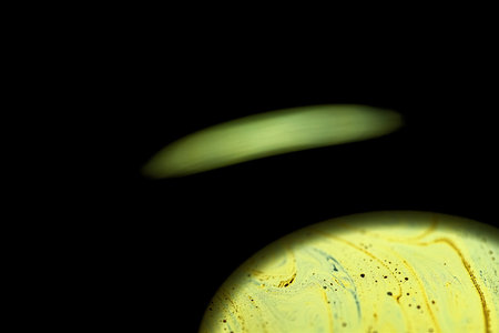 Multicolor psychedelic abstract round planet in universe. Closeup soap bubble like an alien planet...