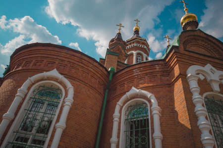 The bell tower of an Orthodox church against the sky.の写真素材